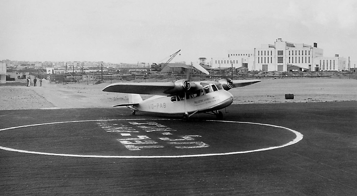 British-built Short S.16 Scion of Palestine Airways Ltd (Land of Israel Airways Ltd in Hebrew), the first airline based in the Holy Land. For aircraft registration purposes, the letters ‘VQ-P’ were assigned to British Mandate Palestine. Shown is VQ-PAB, one of the first two aircraft registered in Palestine, at the newly paved airfield (now Dov Hoz Airport) in north Tel Aviv, with the Reading power plant in the background. 1 April 1938. (Israel Government Press Office) 