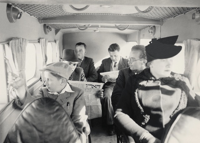 The cabin of a Short S.16 Scion of Palestine Airways, February 1939. The fabric-covered metal frame aircraft seated six passengers. One customer is reading the Hebrew newspaper Ha’aretz, still published today. (Israel Government Press Office) 