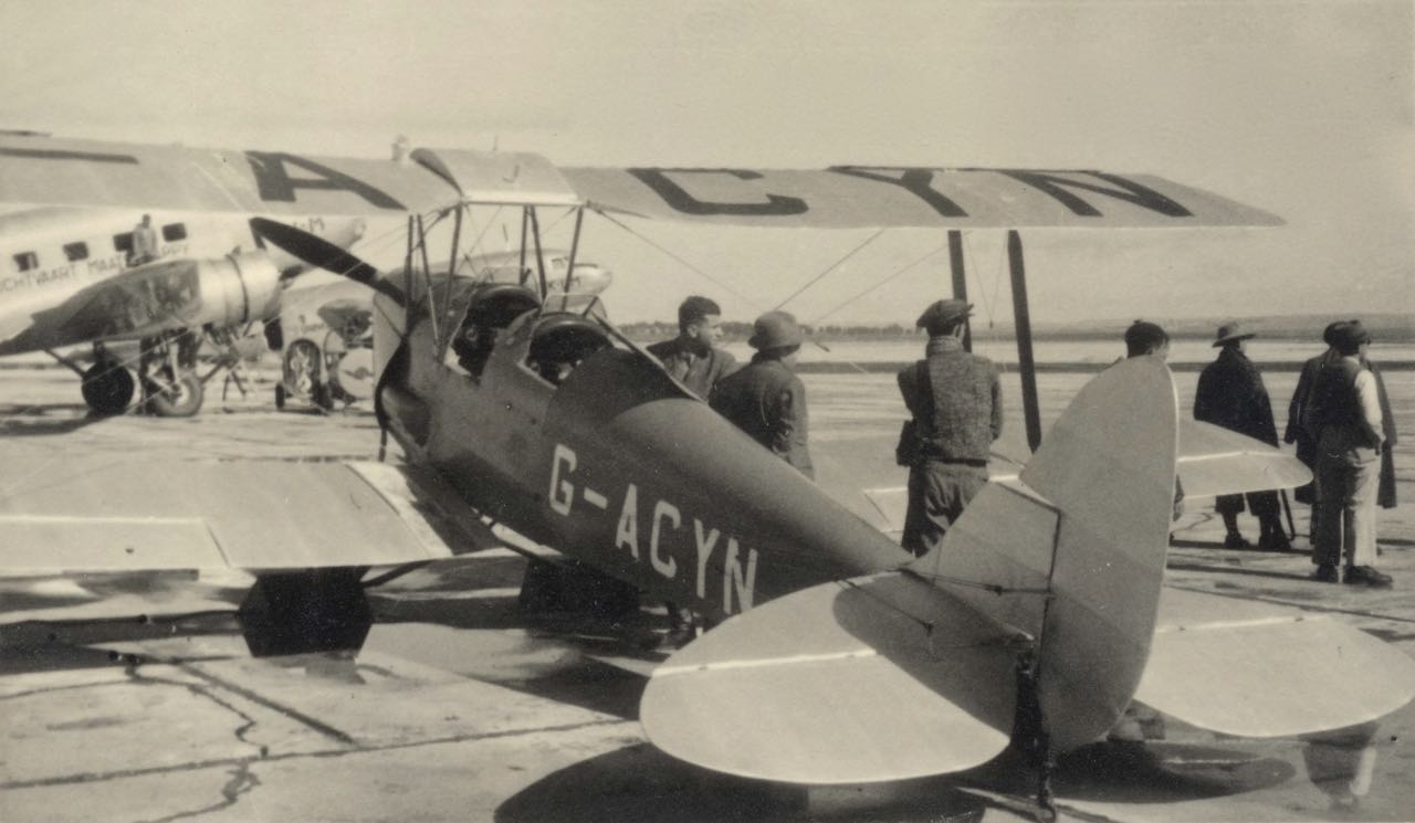 The first motorized aircraft of the Jewish settlement in Israel: a British-registered de Havilland D.H.82A Tiger Moth acquired through Israeli aviation pioneers Yitzhak Chizik and Dov Hoz in September 1934, taken at Lydda Airport about 1938. Being refueled in the background are two KLM Royal Dutch Airlines Douglas DC-3s operating the East Indies route. (MG collection, via Capt Yitzhak Hennenson) 
