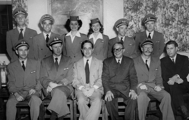 The crew of EL AL's first flight to Johannesburg, South Africa, in November 1950. Left to right, back row: Lou Mazerow (radio operator); Pete Rivas (flight engineer); Livia Eisen Chertoff (stewardess); Chaya Tarnar (stewardess); Herbert Kweller (first EL AL steward); Dell Webb (radio operator). Front row: Len Jaffe (first officers); Bob Moorehead (captain); Aryeh Pincus (first president of EL AL); Herbert Cranko dsirector of administration and finance, and former managing director of Universal Airways of South Africa, acquired by EL AL in 1950); Marty Leveseur (captain); and Sam Hirschmann, EL AL Africa representative and formerly with Universal). (MG collection via Livia Eisen Chertoff; Henry Jacobs photo)