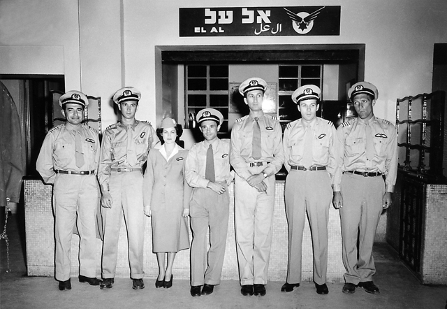EL AL flight crew for the Herzl flight, 16-17 August 1949. Left to right: Bob Morse (captain); Herb Bornstein (flight engineer); Carmella Moyal (stewardess); Herbert Kweller (steward); Eliezer Kovacs (navigator); Leo St. Denis (radio operator); Norman Moonitz (captain). By this time EL AL had introduced uniform insignia made of cloth (rather than metal), embroidered with gold thread. (Israel Government Press Office)