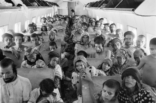 Yemenite airlift flight in a DC-4 operated by an EL AL crew. Forty thousand Jews from Yemen were rescued in 1949 by Operation Magic Carpet through flights from Aden to Lod Airport, Tel Aviv. The wooden benches are filled to maximum capacity. (American Jewish Joint Distribution Committee Archives)