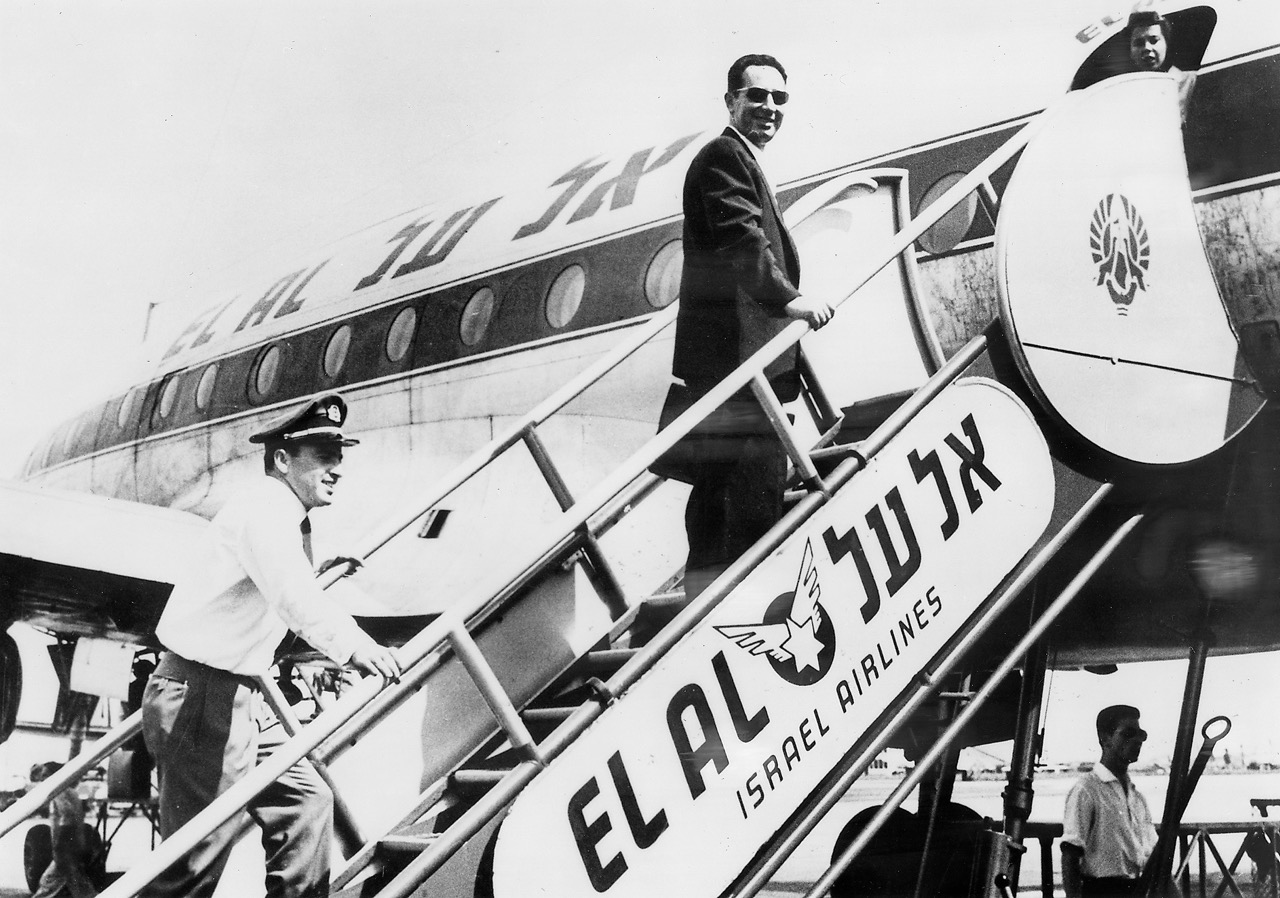Shimon Peres, then director general of Israel's Ministry of Defense and later prime minister of Israel, boarding a Constellation at Lod Airport in the mid-1950s. EL AL's Joe Klein is at the foot of the stairs. (EL AL Archive) 