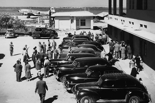 EL AL’s first ground fleet at Lod Airport, mainly Chryslers and DeSotos acquired in Queens, New York by Ozzie Goldman, EL AL’s manager of material control at Lod and seventh hired employee. Ozzie later became administration manager for EL AL USA and enjoyed a remarkable 50 year career at the airline. In the background is a C-46 in Alaska Airlines markings, employed on the Yemenite airlift, 1949. (Ozzie Goldman photo). 