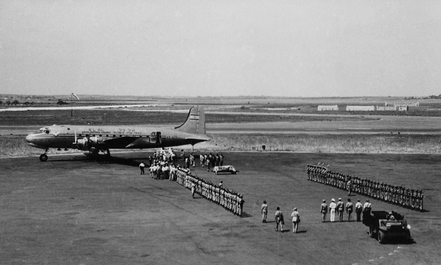 The honor guard is tense as the draped coffin of Theodor Herzl, founder of Zionism, pauses ceremoniously at Lod Airport, having been flown aboard EL AL’s DC-4 Herzl from Vienna for reburial in Jerusalem, 17 August 1949. (Ozzie Goldman Photo)