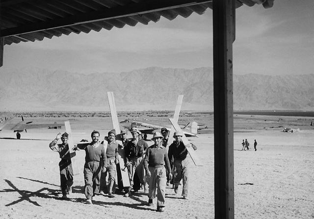 Constructing the first passenger terminal at Eilat, Israel, 28 February 1950. Eilat, now a thriving tourist sun resort on the Red Sea, was barren land at the time. In the background are (left) an EL AL C-46 (4X-ACT) and a DC-3 named ‘Galilee’ of South Africa's Universal Airways, operated to Eilat by an EL AL crew. (Israel Government Press Office) 