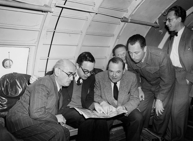 Aboard EL AL/Arkia's first official flight to Eilat, Israel, 28 February 1950, in Curtiss C-46 4X-ACT. The cabin is bare of furnishings and without soundproofing. Left to right (first four persons): Yaacov Hozman (first President of Arkia); Aryeh Pincus (first President of EL AL); Avraham Ryvkind (first head of commercial operations of EL AL); Danny Rosin (at back, an EL AL pilot). (Israel Government Press Office) 
