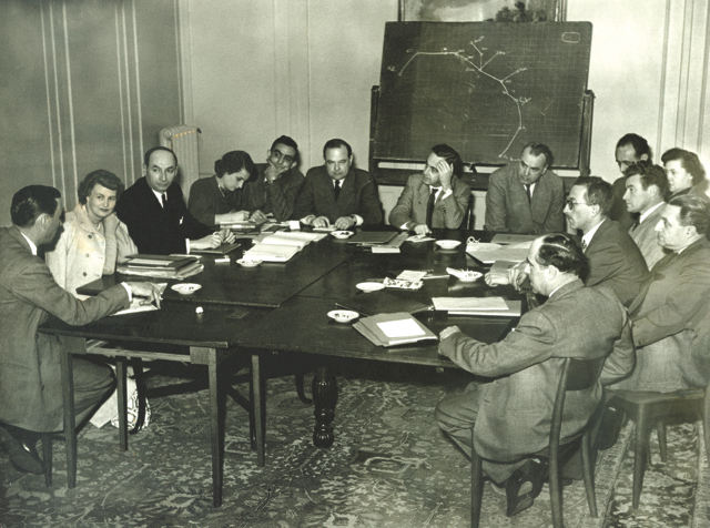 First meeting of commercial representatives of EL AL, held in Zurich, 22-24 February 1951. Left to right around the table: possibly Capt. R. C. Waring (chief of flight operations); Mrs. Gratz (traffic manager representing H. Cranko, commercial representative ('rep') for South Africa; Joseph Massis (rep for France); Hadassah Perlberg (secretary, commercial division); Yerachmiel (Yeri) Shrem (traffic manager, Tel Aviv office); Avraham Ryvkind (commercial manager); Aryeh Pincus (managing director); P. Blomquist (consulting engineer); Hans Winter (rep for Switzerland); Mrs. I. Friedrich (rep for Austria); Yehudah Koppel (rep for North America); Dror Galezer (administrator at Lod Airport); Joseph Weniger (rep for Italy); Joseph Penueli (rep for Great Britain). (EL AL Archive)
