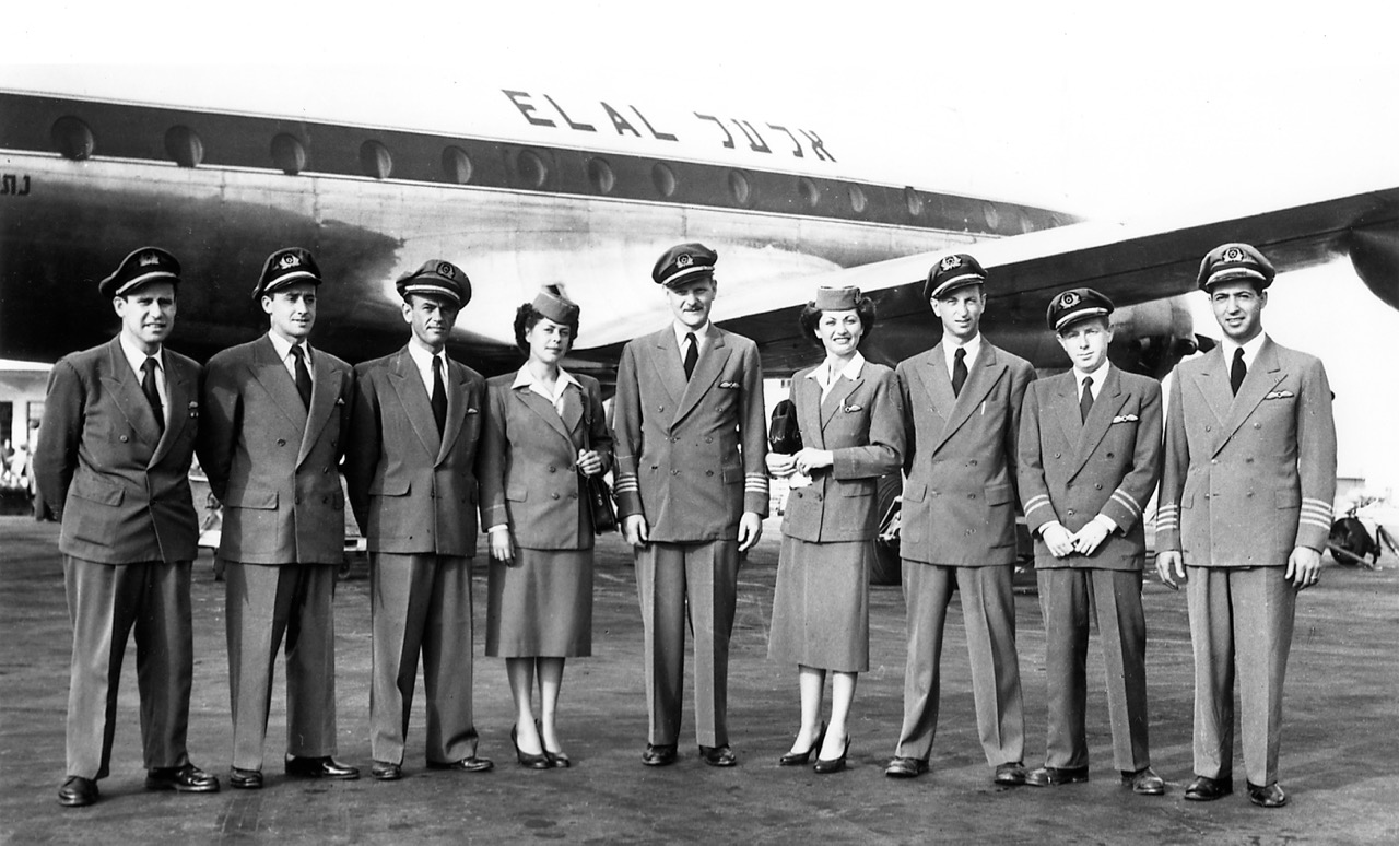 Flight crew wearing the earliest uniforms during Constellation service, 1951. Left to right: Max Diamant (steward), Ze'ev Rondell (steward); Joe Debsky (steward); Kitty Lowenthal Tohar (stewardess); Bernie Hoffman (captain); Livia Eisen Chertoff (stewardess); Herb Bornstein (flight engineer); Dan Lichtenstein Alon (radio operator); Sam Feldman (captain). (EL AL Archive)