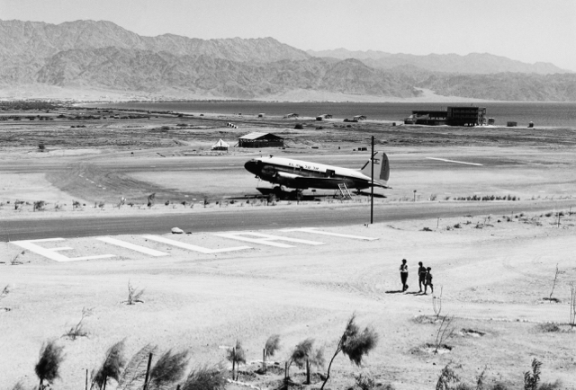 Panoramic early view of Eilat with EL AL C-46 4X-ALC (formerly 4X-ACT”) operated by Arkia, October 1955. Eilat’s first modest hotel sits by the Red Sea shoreline. (Israel Government Press Office) 