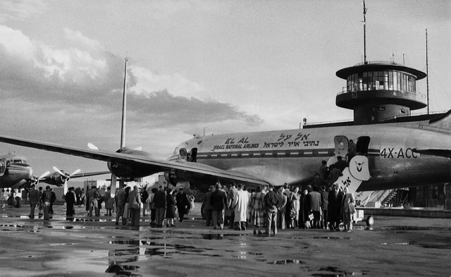 Passengers deplaning from DC-4 4X–ACC at Lod Airport, with 4X-ACD at left. These first two aircraft of EL AL’s fleet operated services to several European capitals. (Ozzie Goldman photo) 