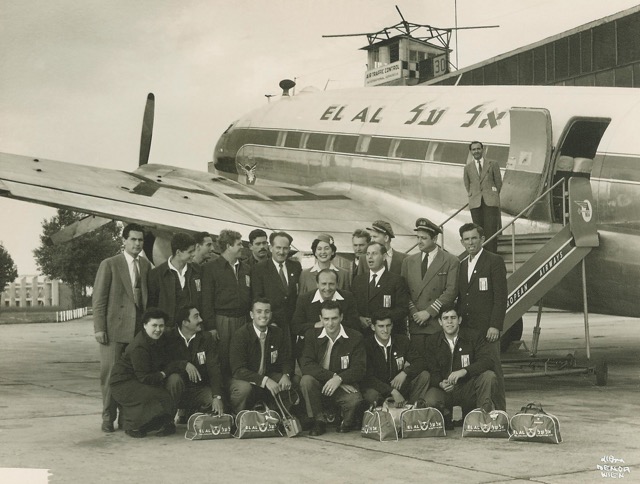 During the Constellation era, EL AL still used its remaining C-46s for cargo and certain shorter passenger flights. Here members of an Israeli Hapoel championship volleyball team pose in front of a C-46 at Vienna, on their way to an international competition in Moscow in 1952. Standing with the group, second from right, is Capt. Allan Cunningham, a former Mahal pilot. (EL AL Archive)
