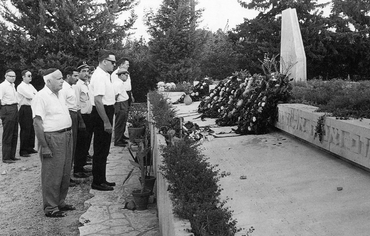 Laying wreaths at the memorial burial site in Kiryat Shaul, Tel Aviv, of the crew of the Constellation (4X-AKC) shot down by Bulgarian fighter aircraft near the Bulgarian-Greek border on 27 July 1955. This photograph was taken on one of the anniversaries of the event. Shlomo Lahat, president of EL AL in 1966-67, is standing in front wearing dark glasses. (EL AL Archive)